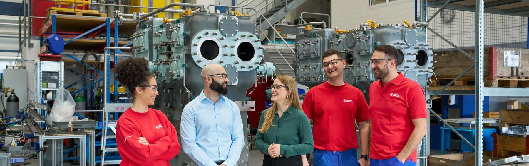 Manufacturing site of Laby compressors employees discussing in front of the Laby compressors