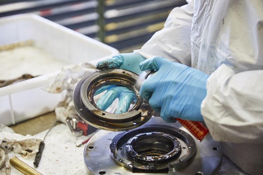 A technician overhauling rings and packing during a maintenance shutdown.