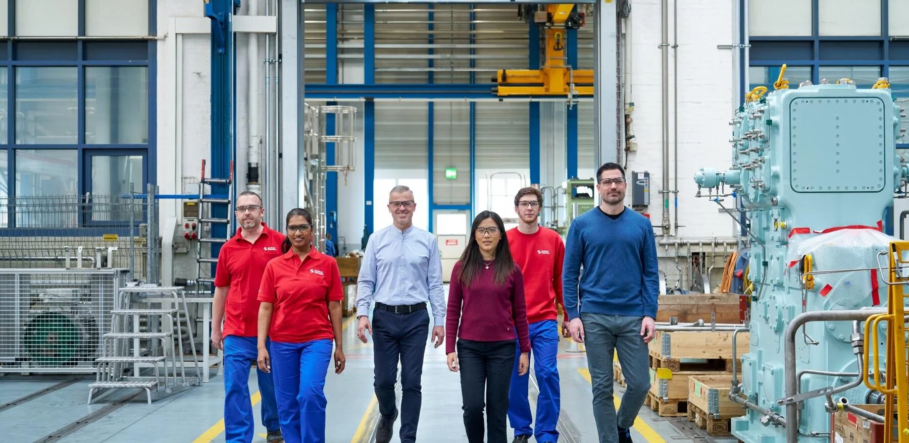 People walking through manufacturing site