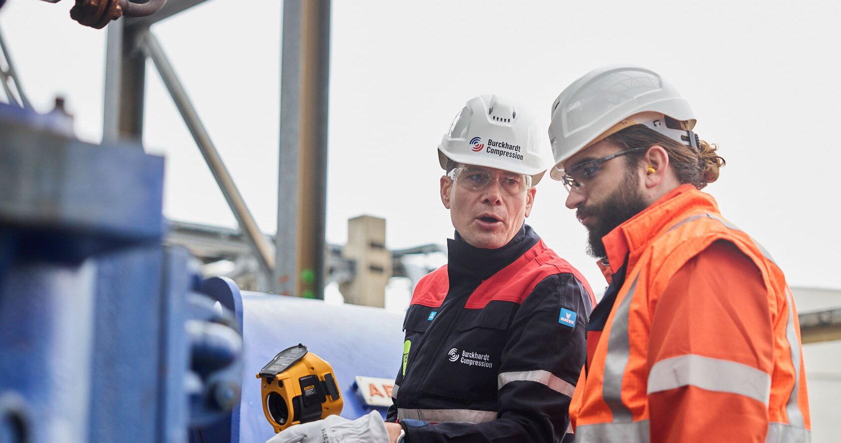 Engineers in the field discussing, Varo Cressier, Switzerland