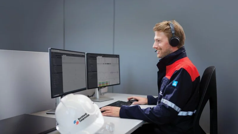 Field service engineer looking at monitors