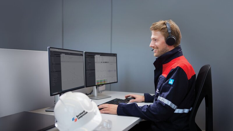 Field service engineer looking at monitors