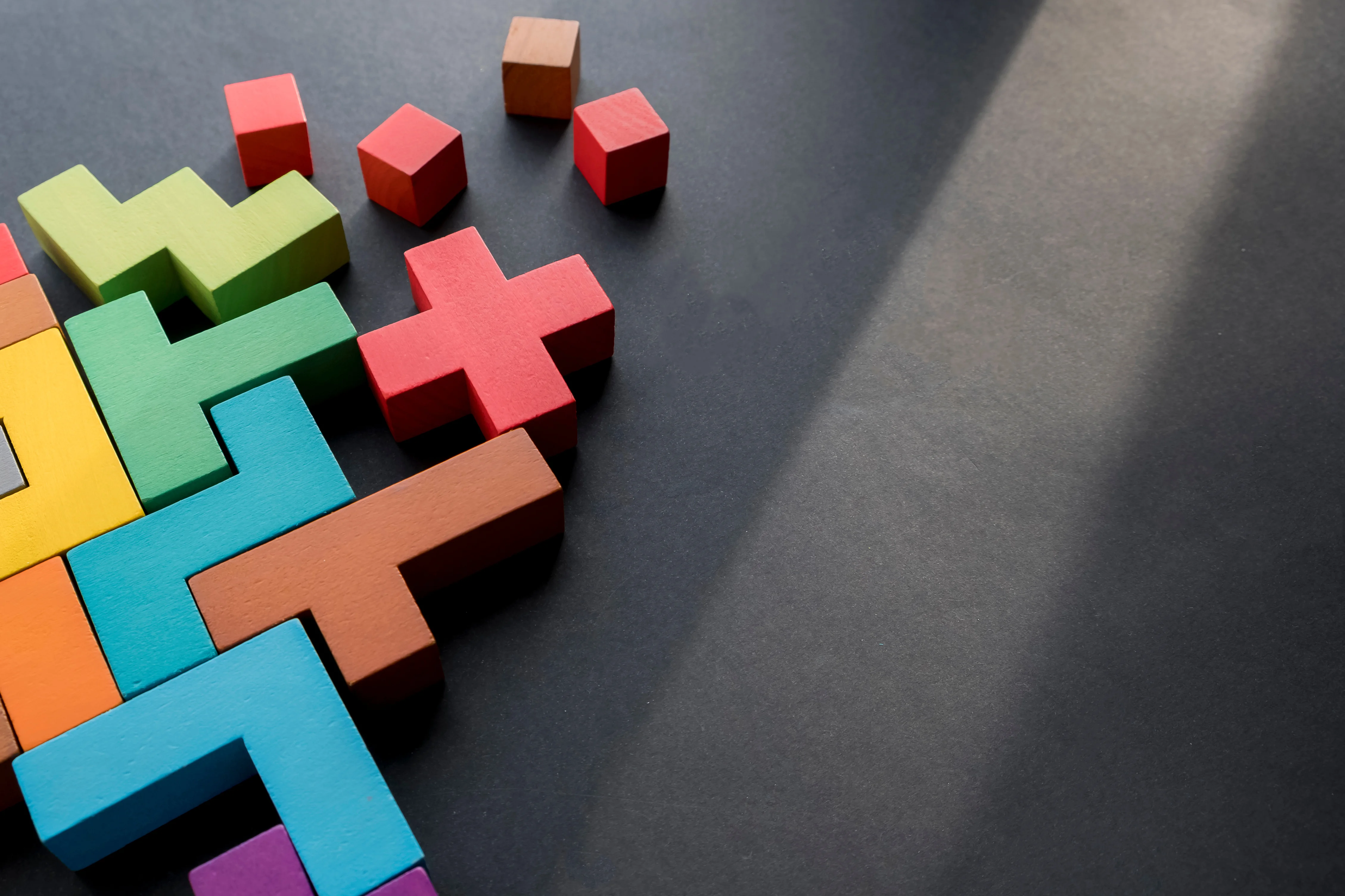 blocks with different shapes and colours fitting in each other
