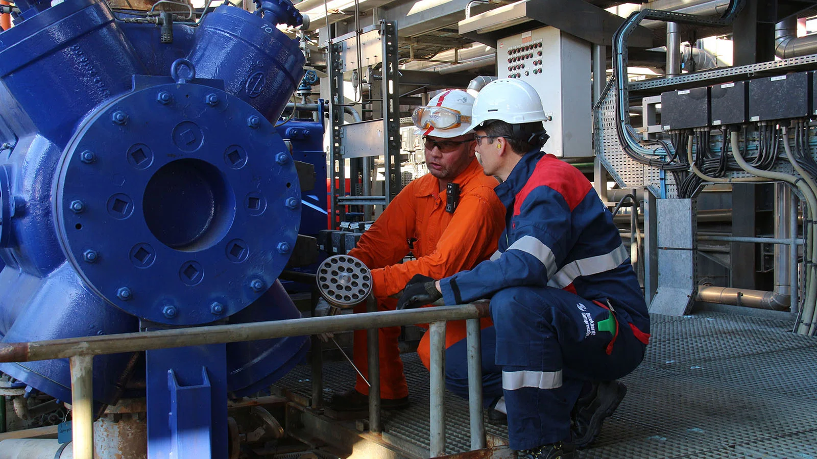 BC technician and customer on site exchanging valve